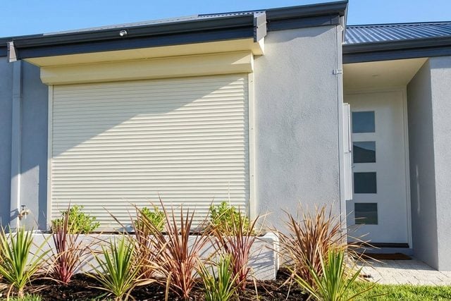 Custom roller shutters on a modern Perth home