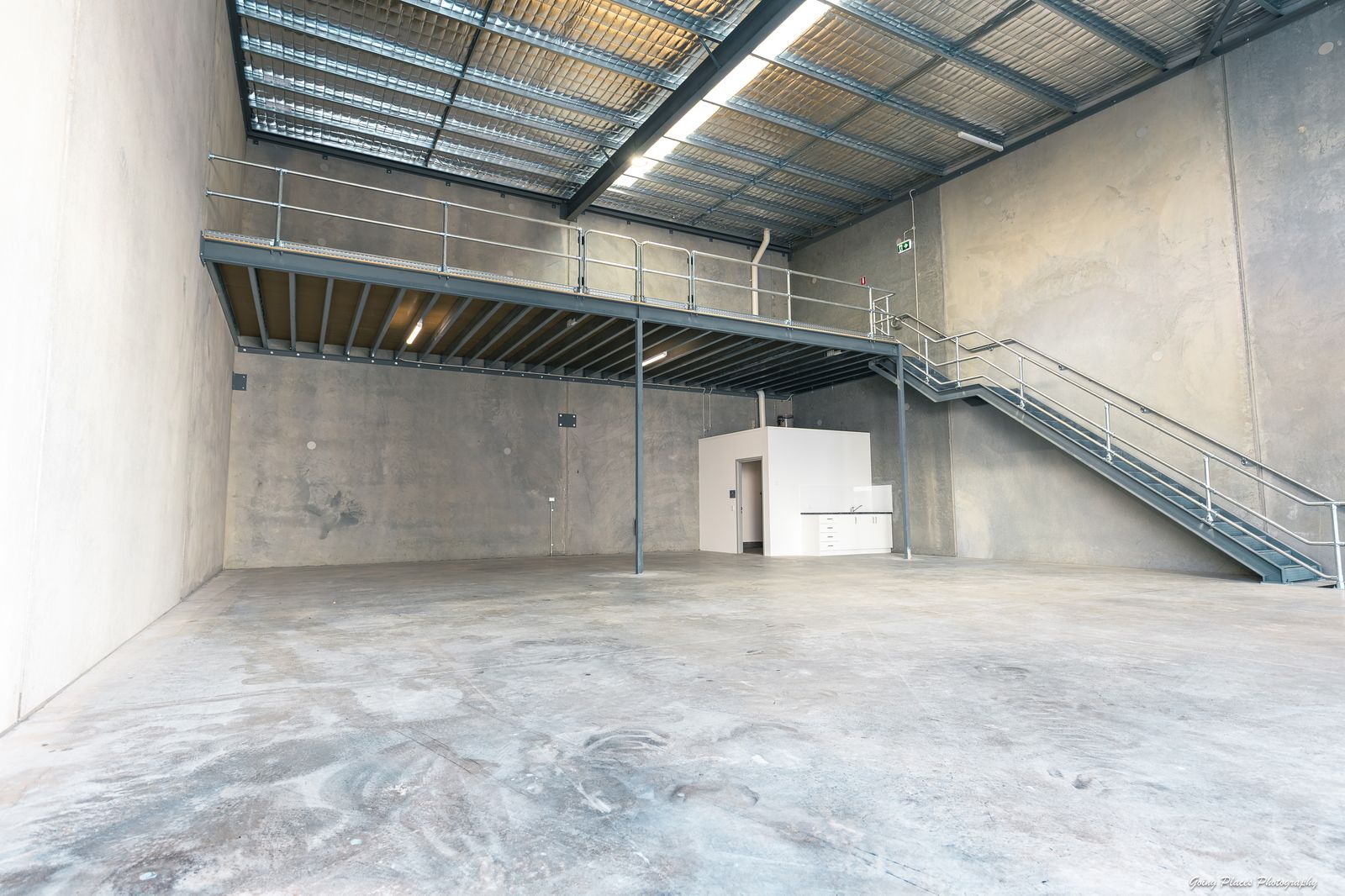 High-clearance warehouse with mezzanine level, kitchenette and staircase