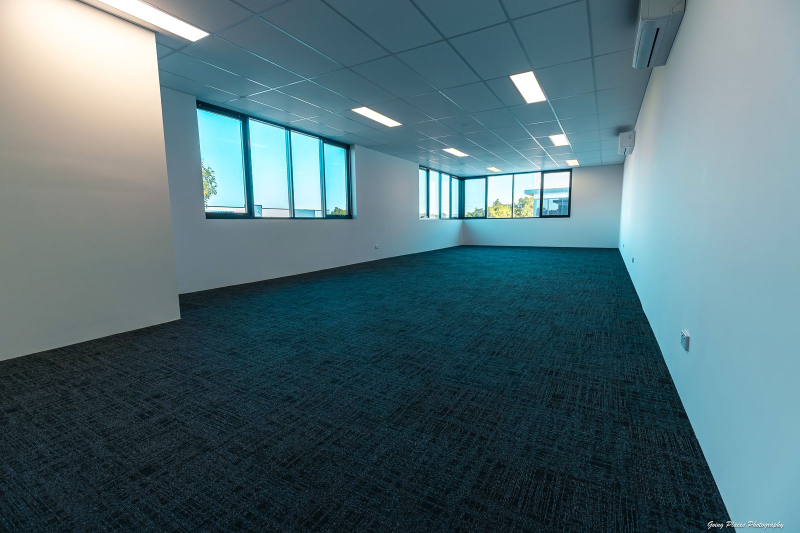 Bright carpeted office space with air conditioning