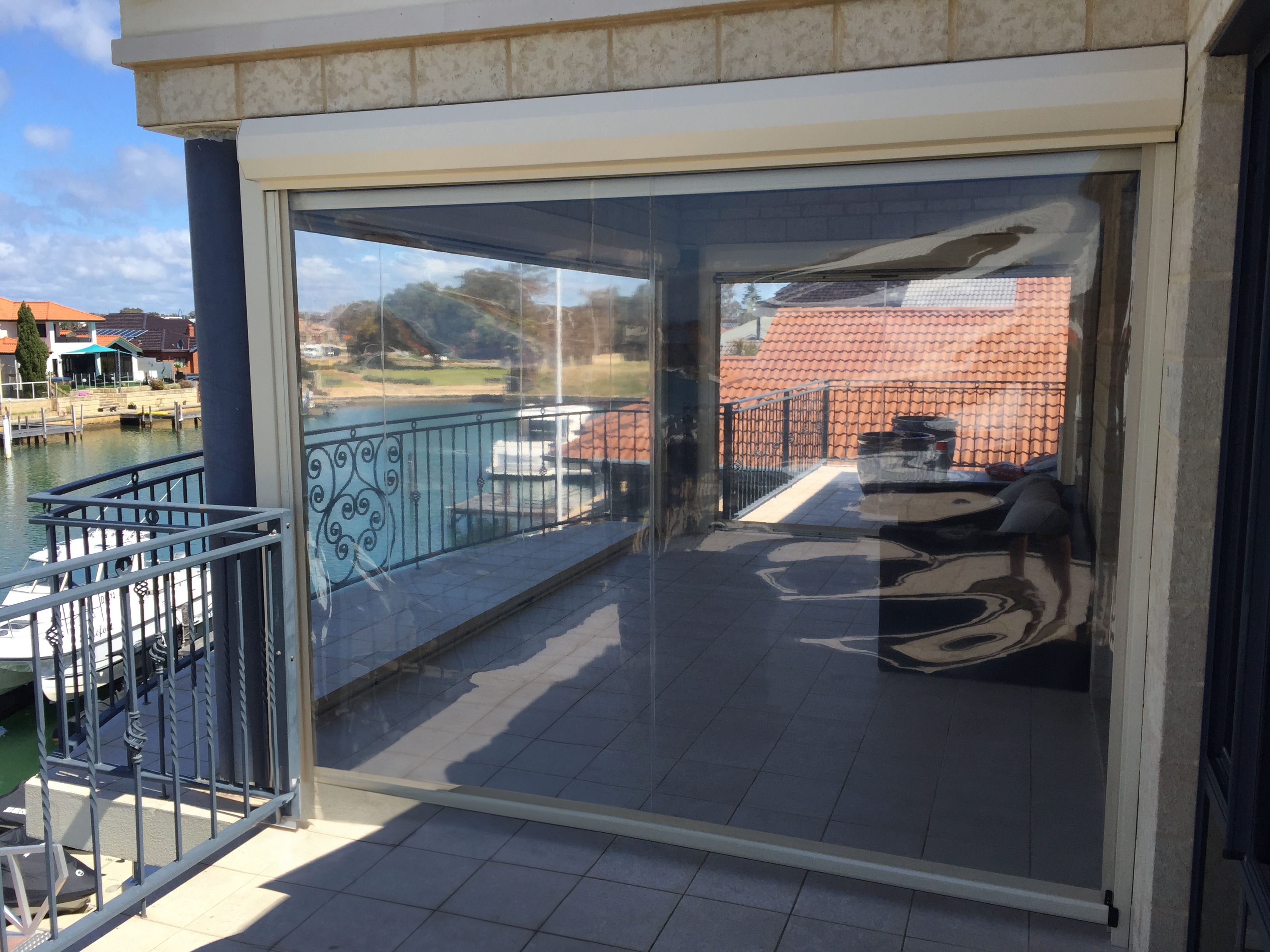 Clear PVC cafe blinds enclosing an outdoor entertaining area
